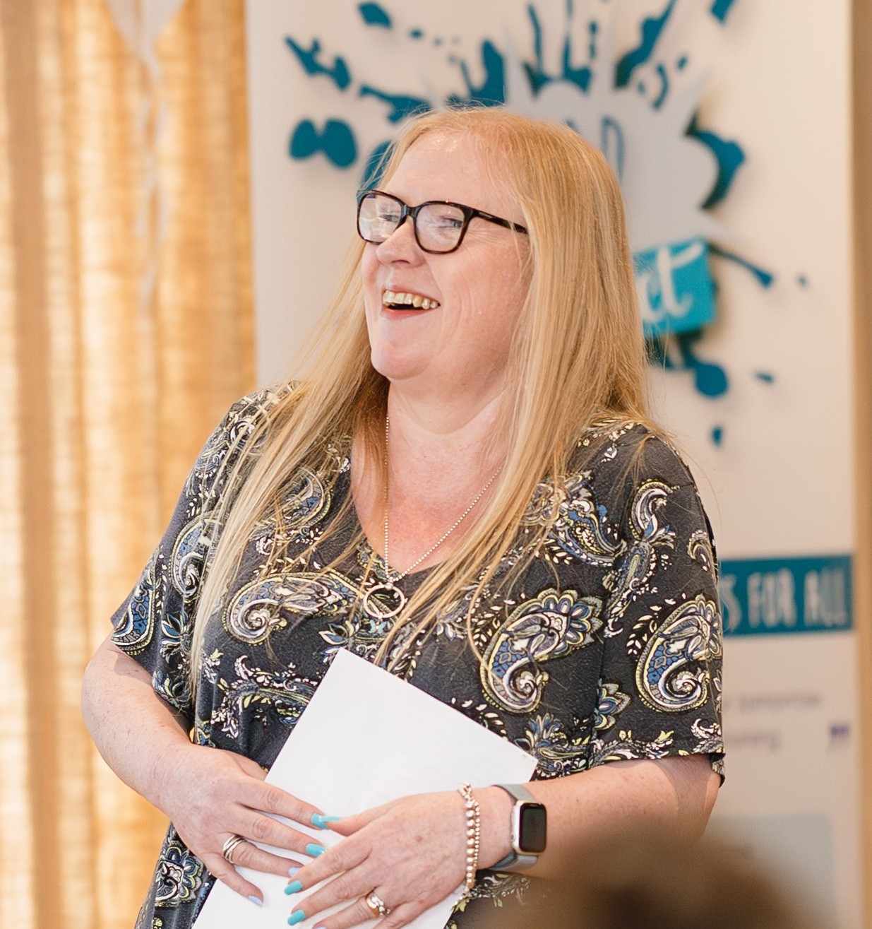 Jackie Lehane speaking to a group during a business session, representing her role as a Certified VA Mentor and Business Strategist.
